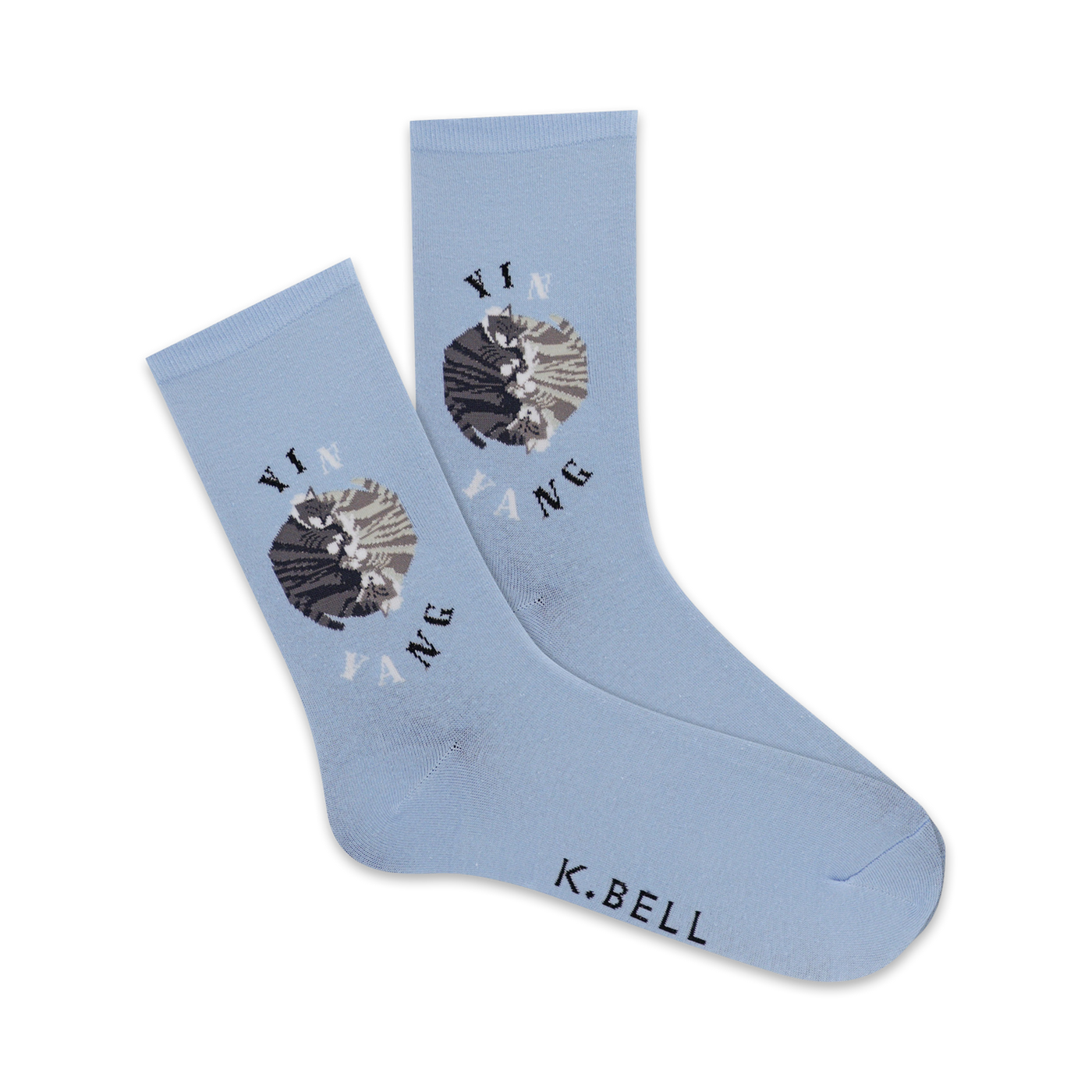 Pair of light blue crew socks with a yin yang design featuring two cats in gray and white.  'Yin Yang' and 'K.Bell' are printed on the socks.