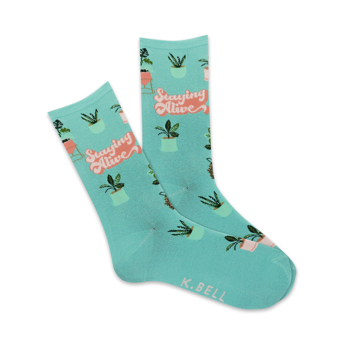 A pair of teal crew socks with a repeating pattern of potted plants and the phrase 'Staying Alive' in a retro font.