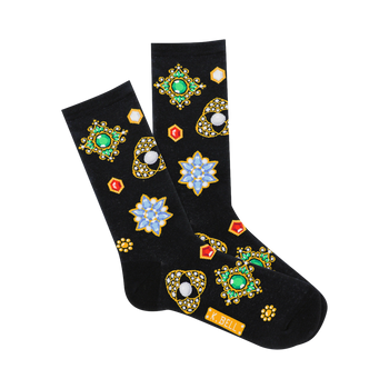 A pair of black crew socks featuring a pattern of colorful jeweled brooches and flower shapes with gold accents.