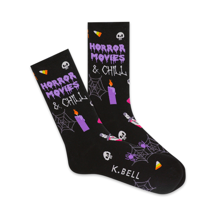 women's black crew socks with purple pattern of cobwebs, skulls, candles, and the words 'horror movies & chill'.    }}