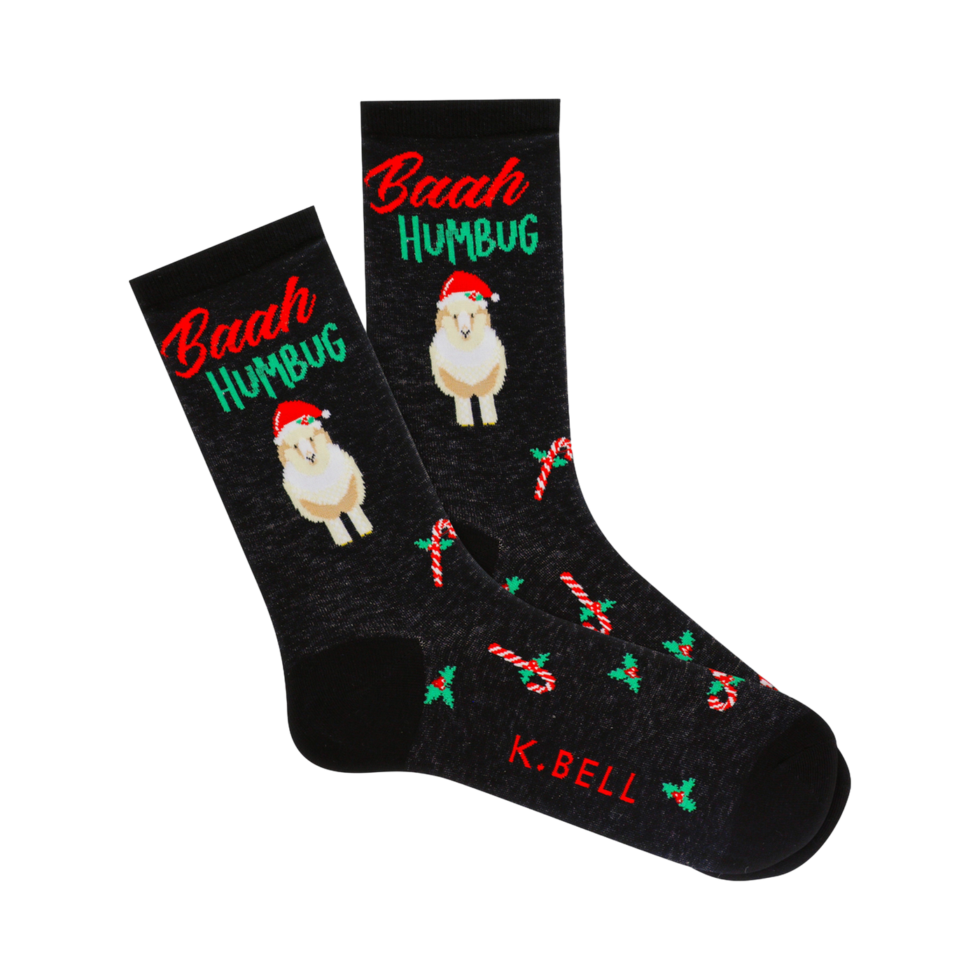 Pair of crew socks, dark gray-black, featuring a sheep in a Santa hat, 'Baah Humbug' text, candy canes, and holly sprigs.