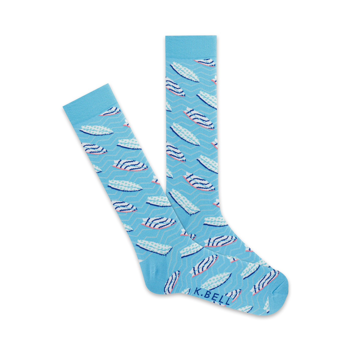 A pair of light blue crew socks with a pattern of pink and white surfboards on a wavy background. The socks are folded to show both sides of the design.