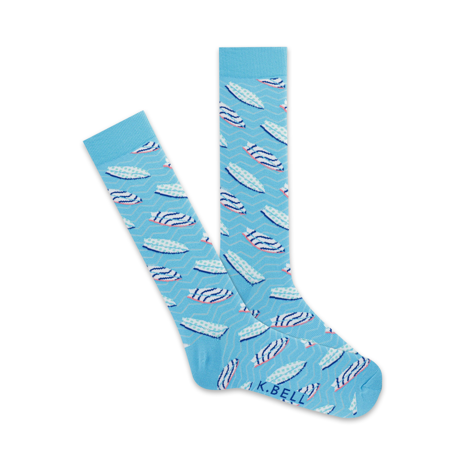 A pair of light blue crew socks with a pattern of pink and white surfboards on a wavy background. The socks are folded to show both sides of the design.