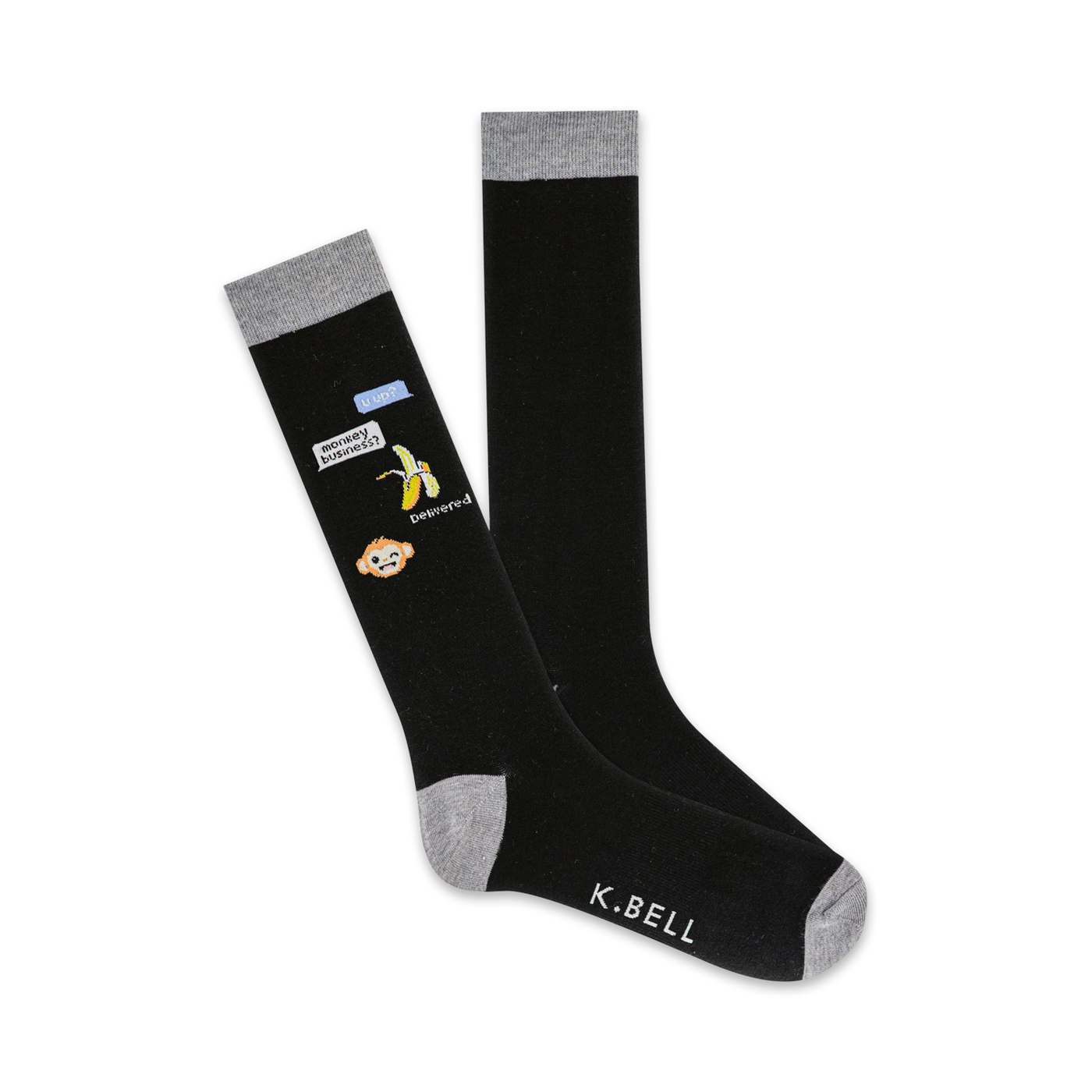 Pair of black knee-high socks with a grey cuff. Features a monkey emoji, banana, and text bubble graphic that says "Monkey Business!"