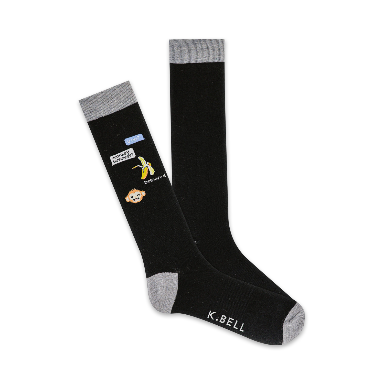 Pair of black knee-high socks with a grey cuff. Features a monkey emoji, banana, and text bubble graphic that says "Monkey Business!"