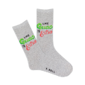 Pair of grey crew socks with the phrase 'Like Guac I'm Extra' in lime green and pink lettering. Fun and vibrant design.