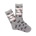 A pair of grey crew socks featuring a repeated pattern of black mute icons and the phrase 'You're On Mute' in pink. 