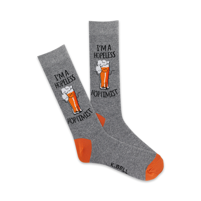 gray crew socks with orange toes and heels. they feature the words 