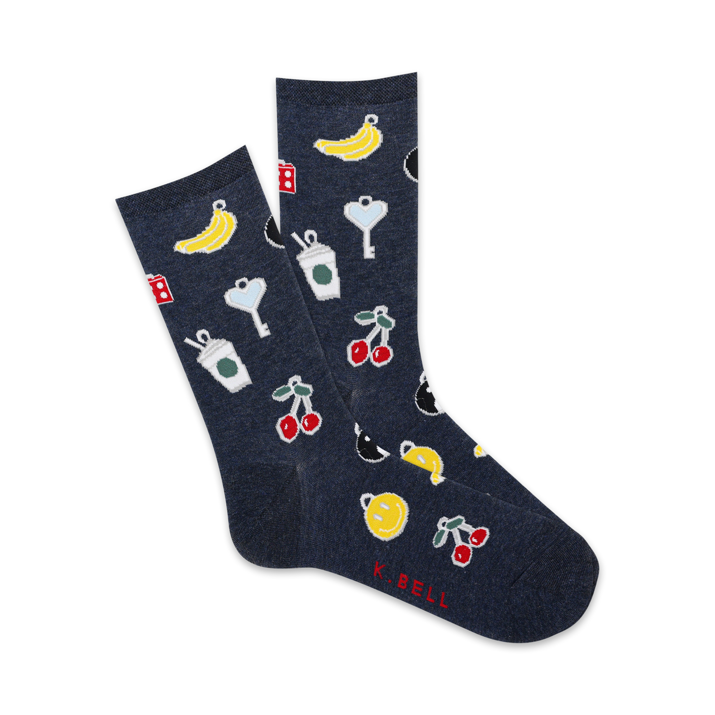 A pair of navy blue crew socks with a playful pattern. The design includes cherries, bananas, coffee cups, dice, and keys in yellow and red.