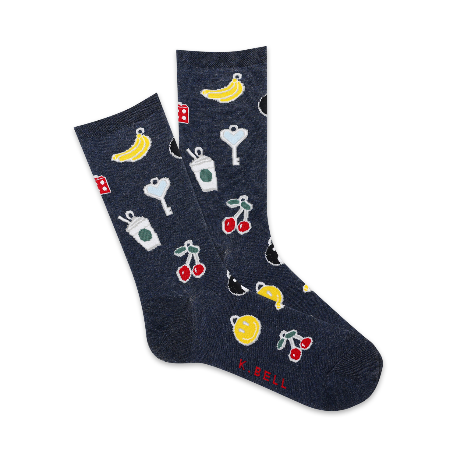 A pair of navy blue crew socks with a playful pattern. The design includes cherries, bananas, coffee cups, dice, and keys in yellow and red.