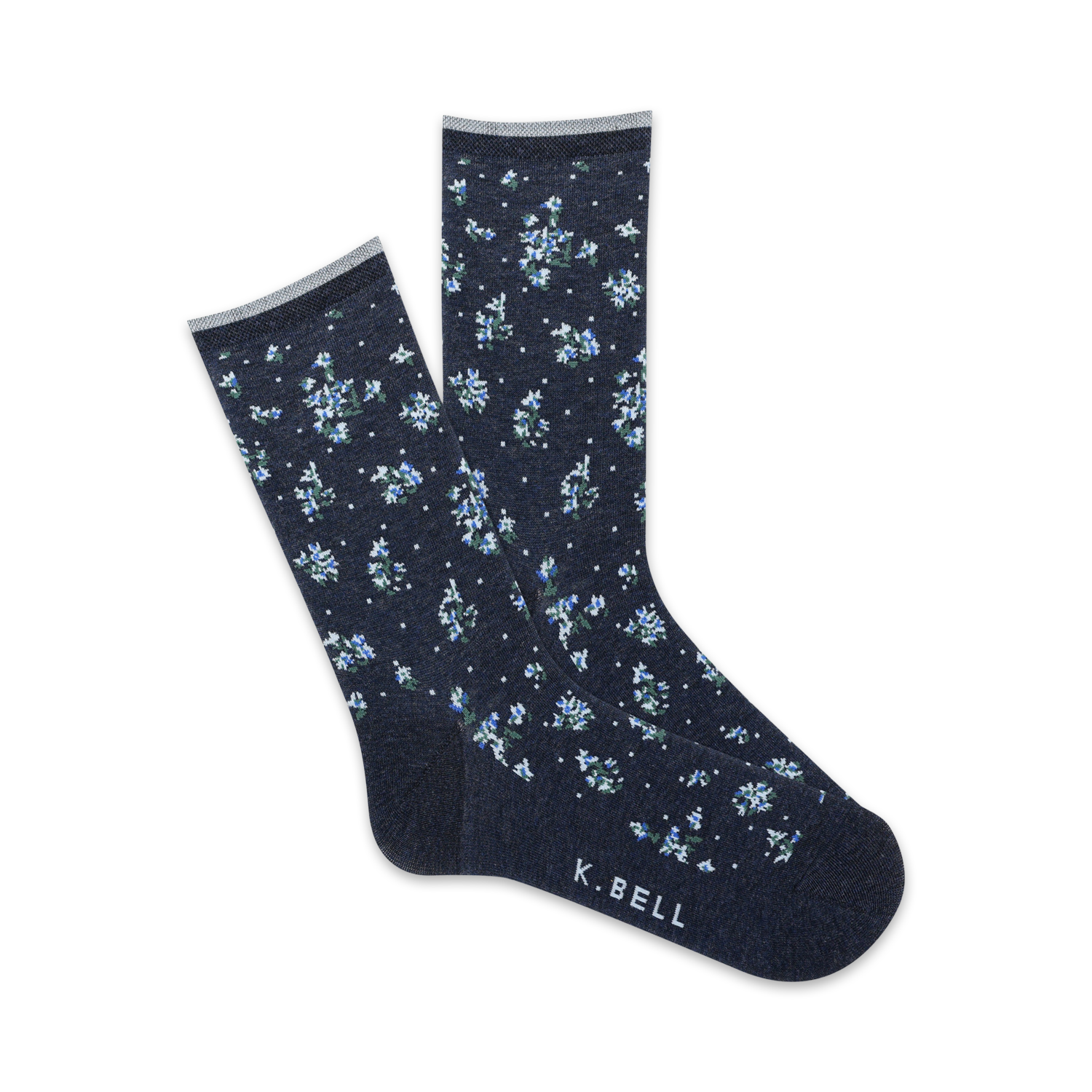 Close-up view of navy blue crew socks with a tiny white floral pattern. Pink trim at the top and 'K.BELL' logo.