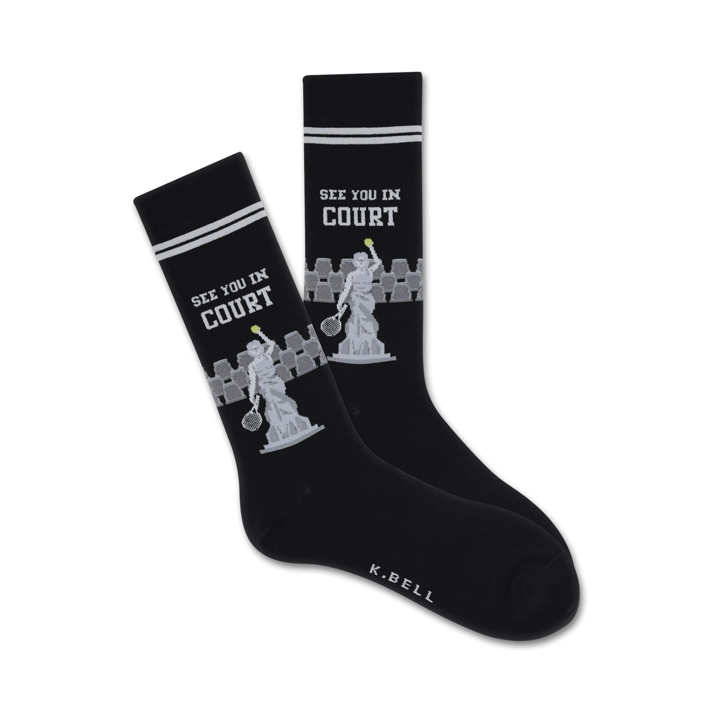 A pair of black crew socks with white stripes at the top.  The socks feature a grey tennis statue design and the words 'See You In Court'.