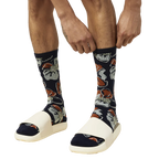 Close-up of a person putting on the Tropical Floral socks, showcasing the detail of the print. [lf]