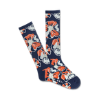 Pair of navy blue crew socks with a repeating pattern of orange and white stylized hibiscus flowers.