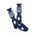 Pair of navy blue crew socks with white golf ball polka dots and the text 'It takes a lot of balls to golf!'