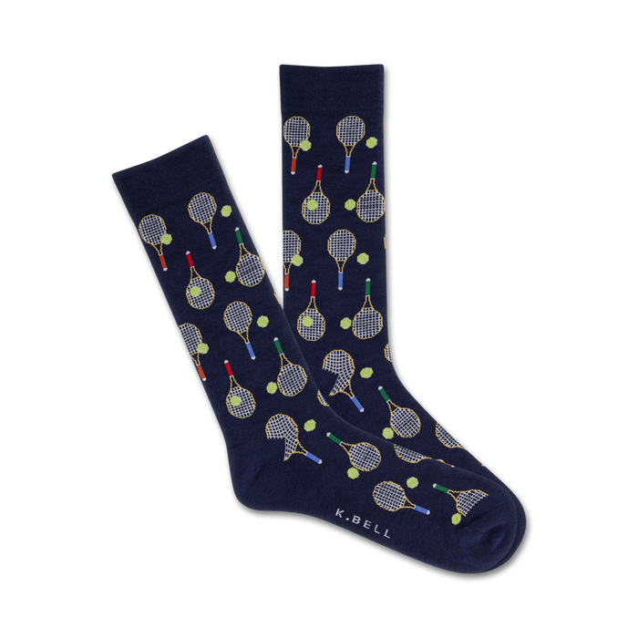 dark blue crew socks feature green, red, yellow, and white tennis balls and brown and white tennis rackets.    }}