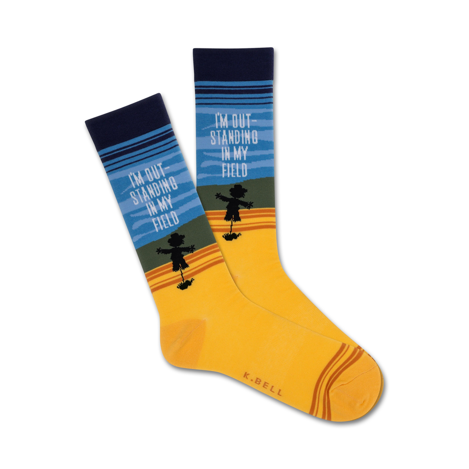 Crew socks in yellow, blue, and green stripes.  A scarecrow silhouette and the text 'I'm Out Standing In My Field' are featured.