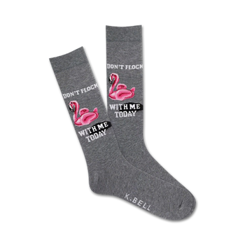 gray crew socks with a pattern of pink flamingos wearing sunglasses and "don't flock with me today" text bubble.  