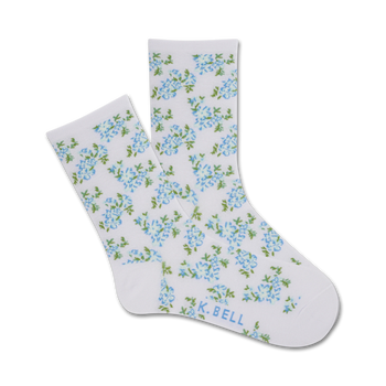 crew length women's socks in white with pattern of small blue flowers and green leaves. perfect for cottage core aesthetic.   