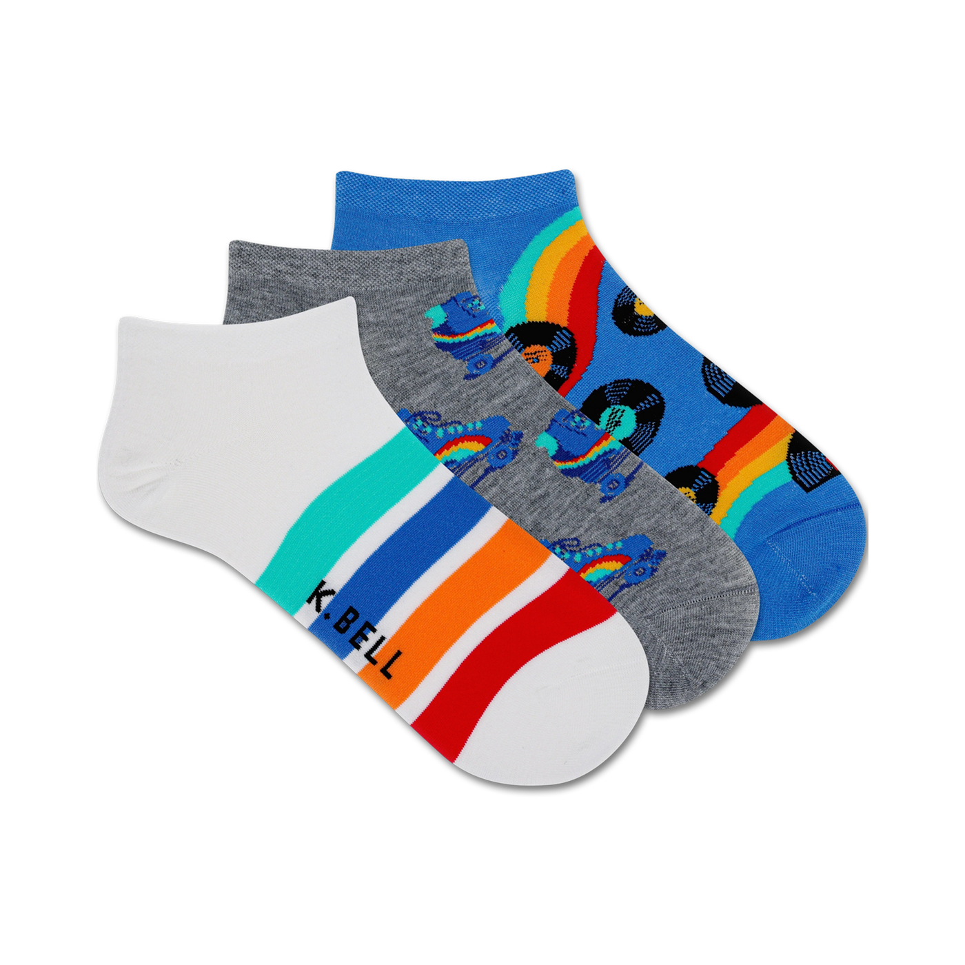 Three pairs of ankle socks. One white with colorful stripes, one gray with roller skates and records, one blue with rainbows and records.