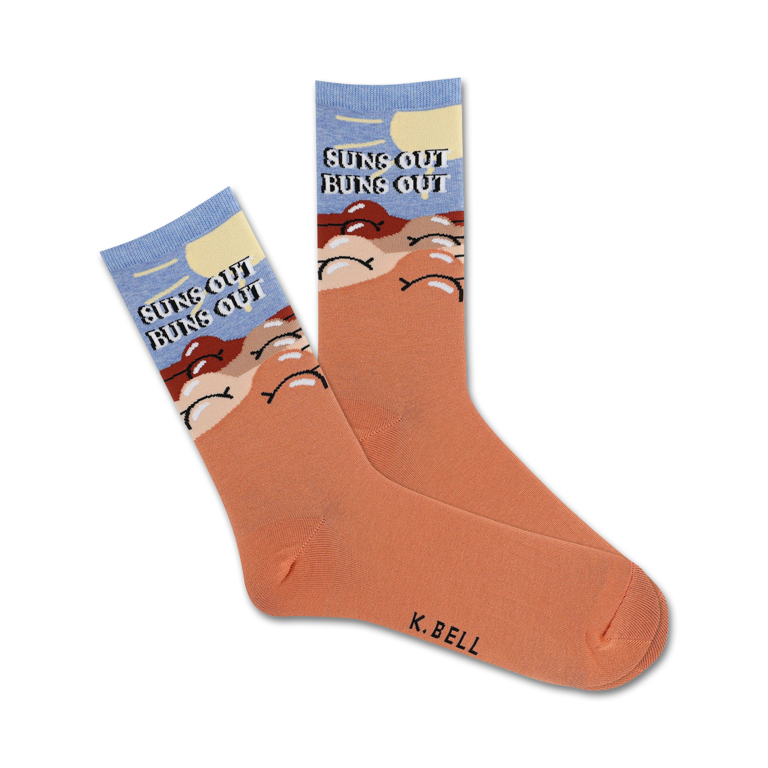 Pair of peach crew socks with a light blue sky, sun, and buns design.  Text reads 'Suns Out Buns Out'.