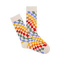 Pair of cream crew socks with a wavy rainbow checkerboard pattern.  Colors include red, orange, yellow, green, and blue.