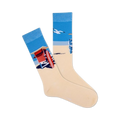 Pair of cream crew socks showcasing a beach scene: blue ocean, lifeguard stand, and a flying seagull. 
