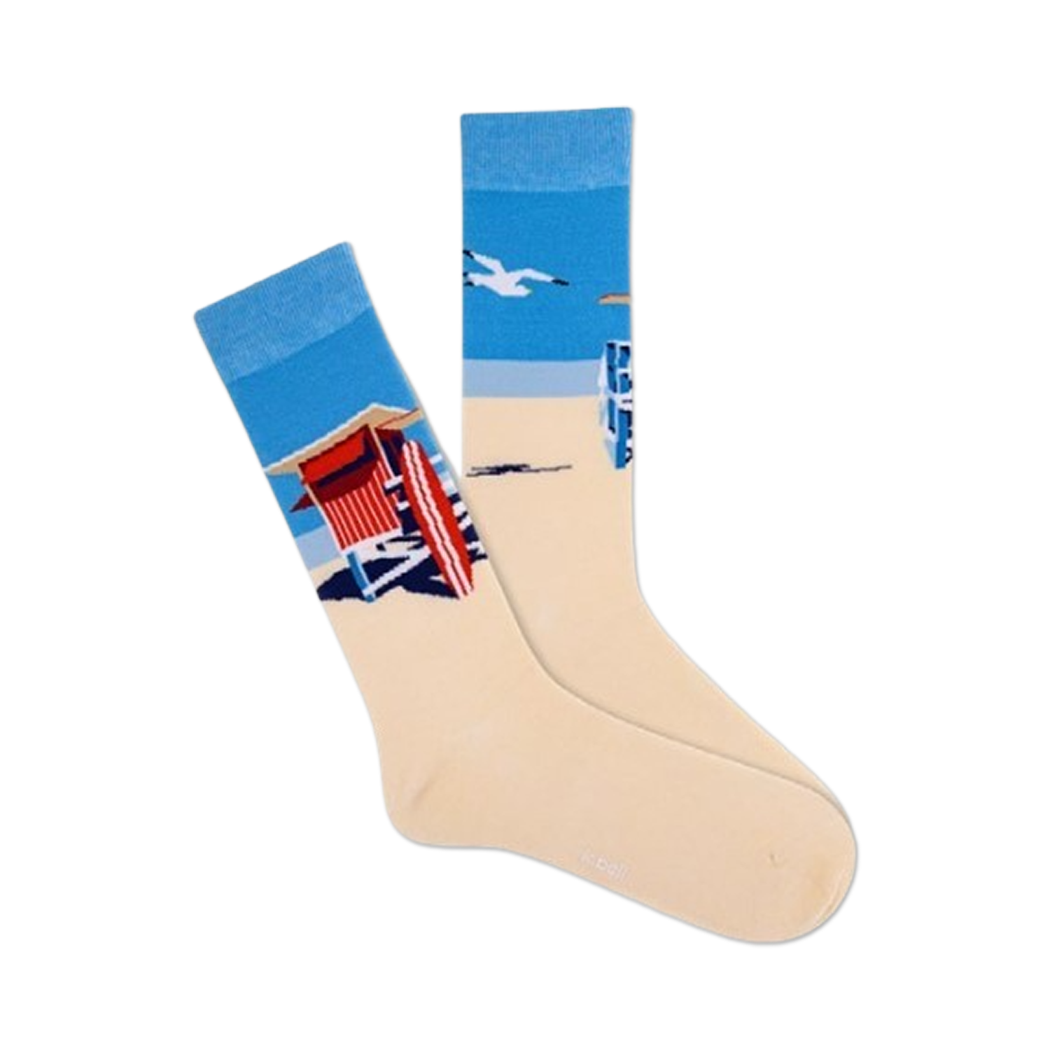 Pair of cream crew socks showcasing a beach scene: blue ocean, lifeguard stand, and a flying seagull. 
