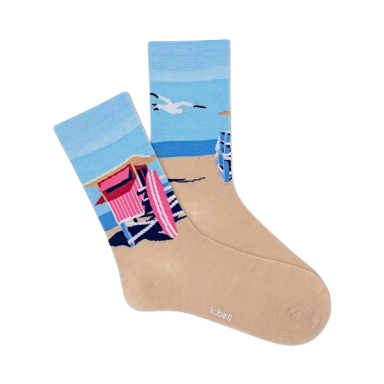 Pair of crew socks showcasing a beach scene with a pink lifeguard hut, ocean, and sand.  Socks are light beige with blue and pink design elements.
