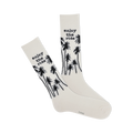Pair of off-white crew socks with black palm tree design and 'Enjoy the Ride' text.