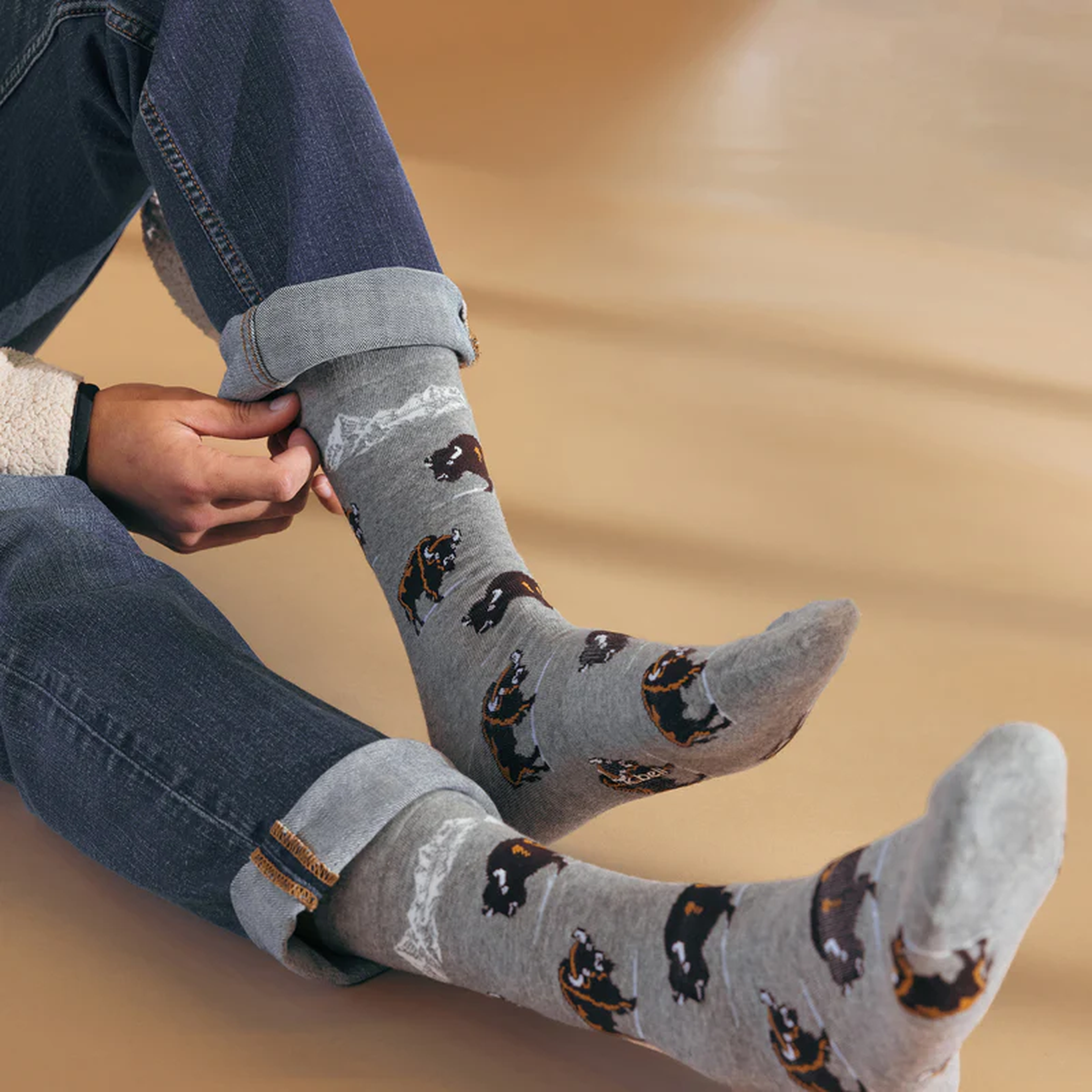 Close-up shot of a person wearing the Winter Bison socks. The image highlights the detailed design and soft fabric.