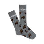 Pair of grey crew socks with a repeating pattern of brown bison and a mountain range graphic. 