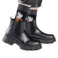 Lifestyle shot showing the socks worn with black ankle boots.