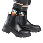 Lifestyle shot showing the socks worn with black ankle boots.