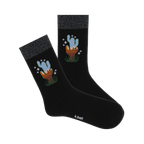 Pair of black crew socks with a sparkly silver cuff and a whimsical cactus design in blues and oranges.