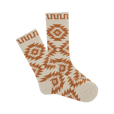 front view of a pair of cream and brown socks with a western motif.