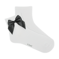 Pair of white ribbed ankle socks with a black satin bow.  The socks are shown against a black background.