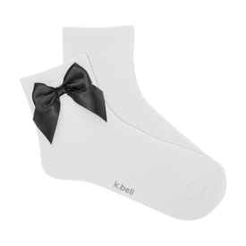 front view of a pair of white ribbed ankle socks with a black satin bow.