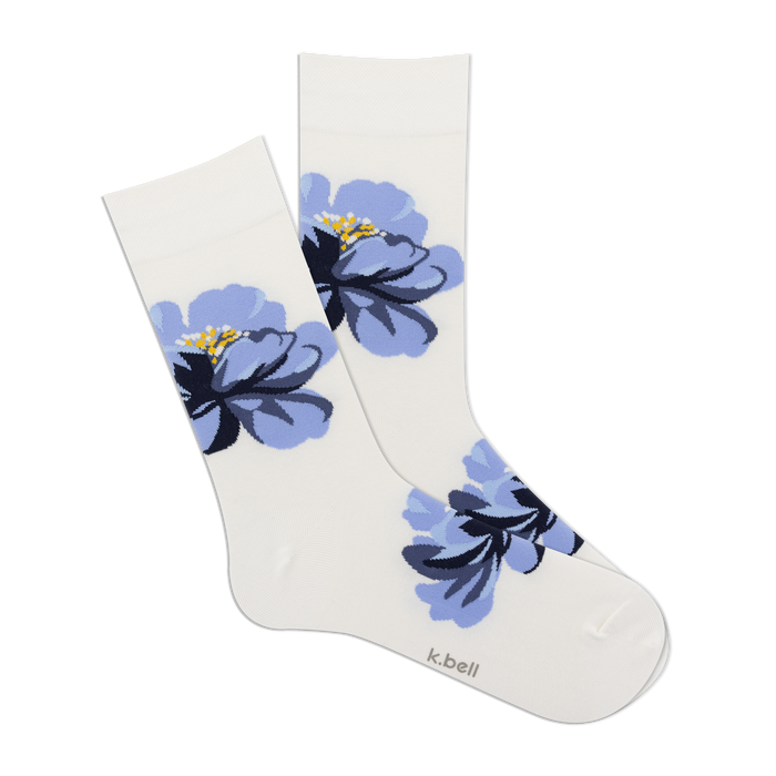 Pair of women's crew socks in white with a large blue floral design.  The flowers are a stylized blue and navy print.