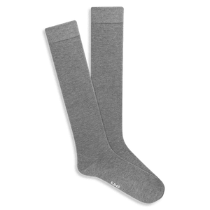 Pair of knee-high light grey Modal socks with subtle ribbed comfort tops, displayed flat on a black background.