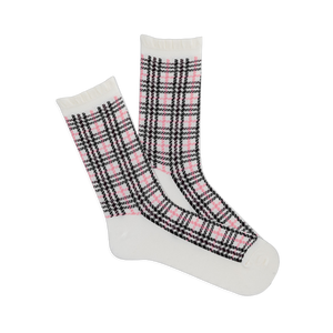 Pair of white crew socks with a pink and black plaid pattern and ruffled cuffs, angled on a white background.
