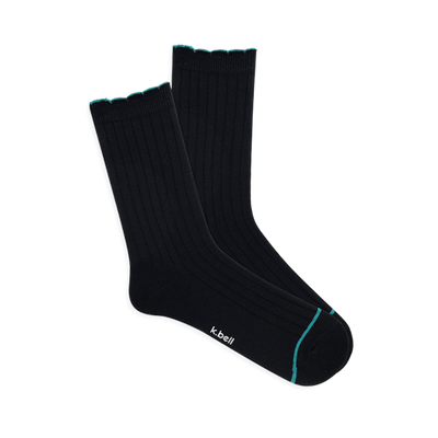 Pair of black ribbed wool blend crew socks with a teal scalloped cuff and a thin teal line on the toe, laid flat.