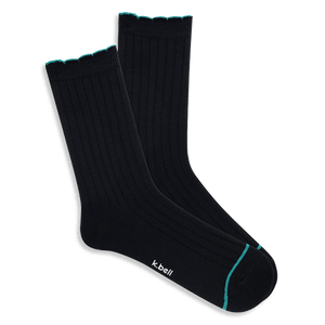 Pair of black ribbed wool blend crew socks with a teal scalloped cuff and a thin teal line on the toe, laid flat.