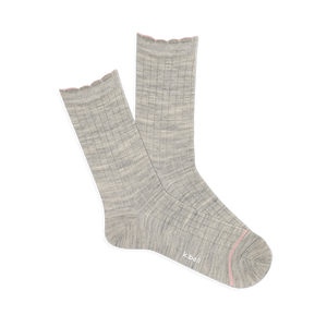 Pair of light grey ribbed wool blend crew socks with a pink scalloped cuff and a thin pink line on the toe, laid flat.