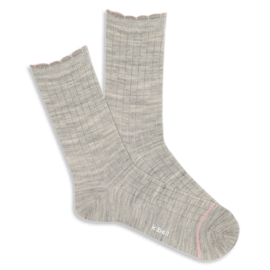 Pair of light grey ribbed wool blend crew socks with a pink scalloped cuff and a thin pink line on the toe, laid flat.