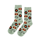 Pair of light green crew socks with a repeating pattern of black vinyl records, orange boomboxes, and black music notes.