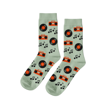 Pair of light green crew socks with a repeating pattern of black vinyl records, orange boomboxes, and black music notes.