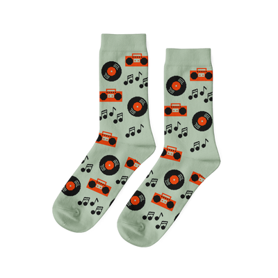 Pair of light green crew socks with a repeating pattern of black vinyl records, orange boomboxes, and black music notes.