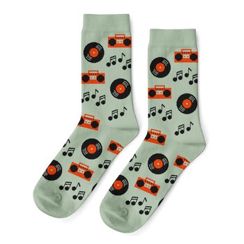 Pair of light green crew socks with a repeating pattern of black vinyl records, orange boomboxes, and black music notes.