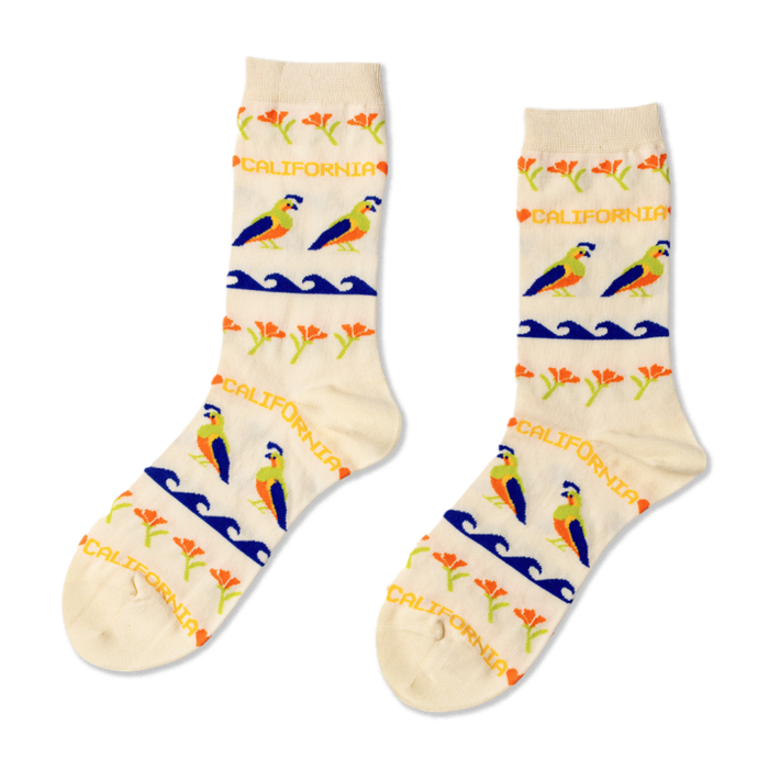 Two crew-length socks, cream background with repeating pattern of blue and orange quail, blue waves, orange flowers, and 